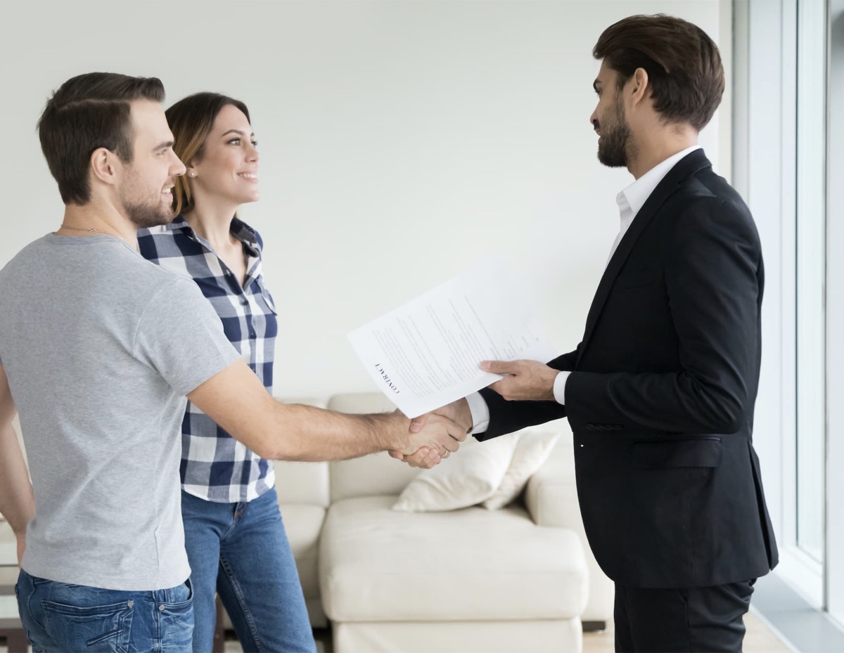 Landlord and agent shaking hands